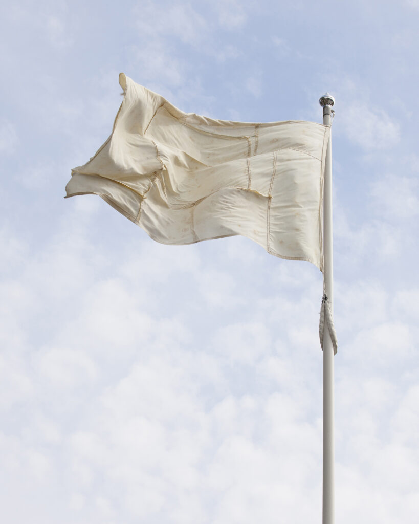 A faded flag artwork flying